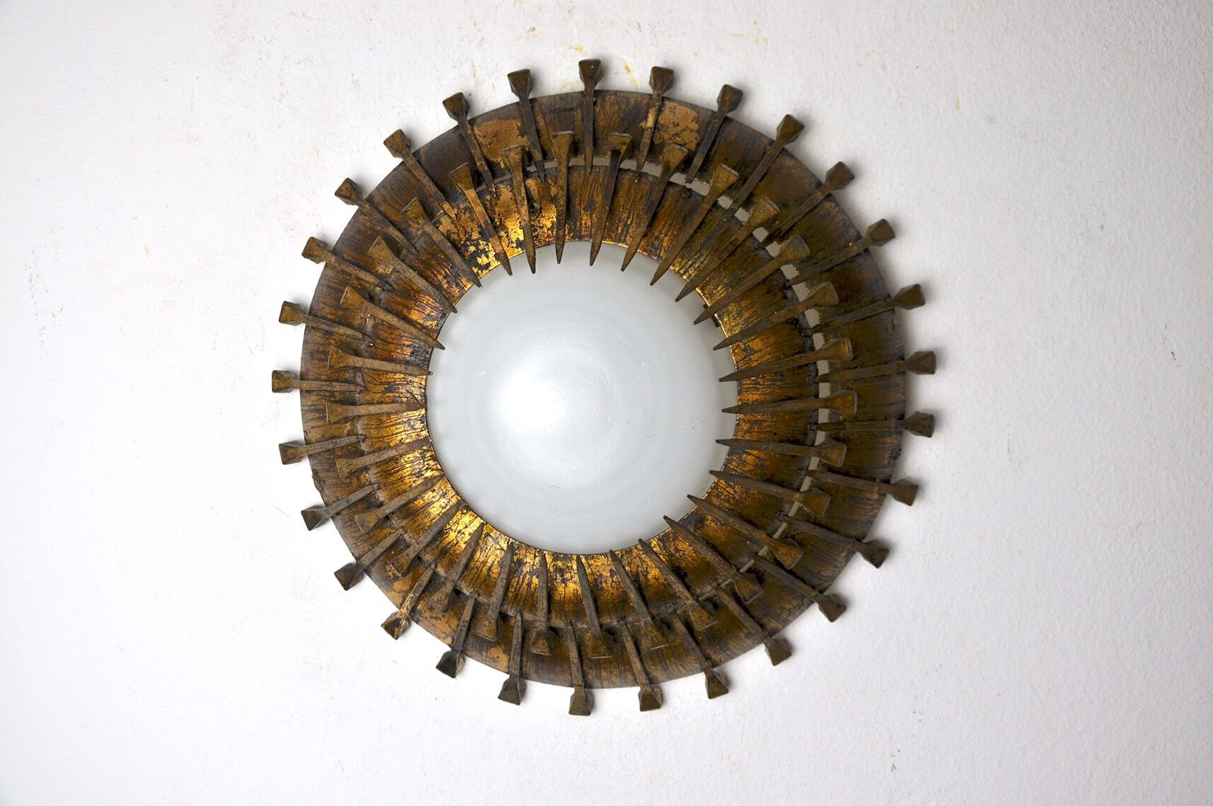 Midcentury brutalist sun wall lamp, metal and gold leaf, Italy