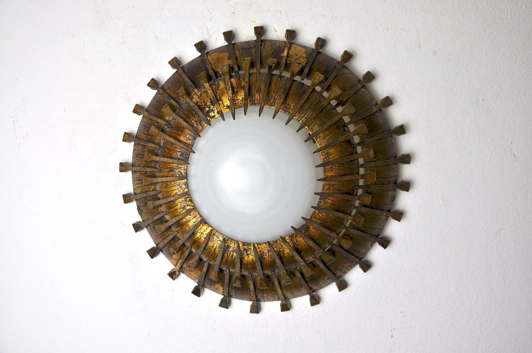 Midcentury brutalist sun wall lamp, metal and gold leaf, Italy