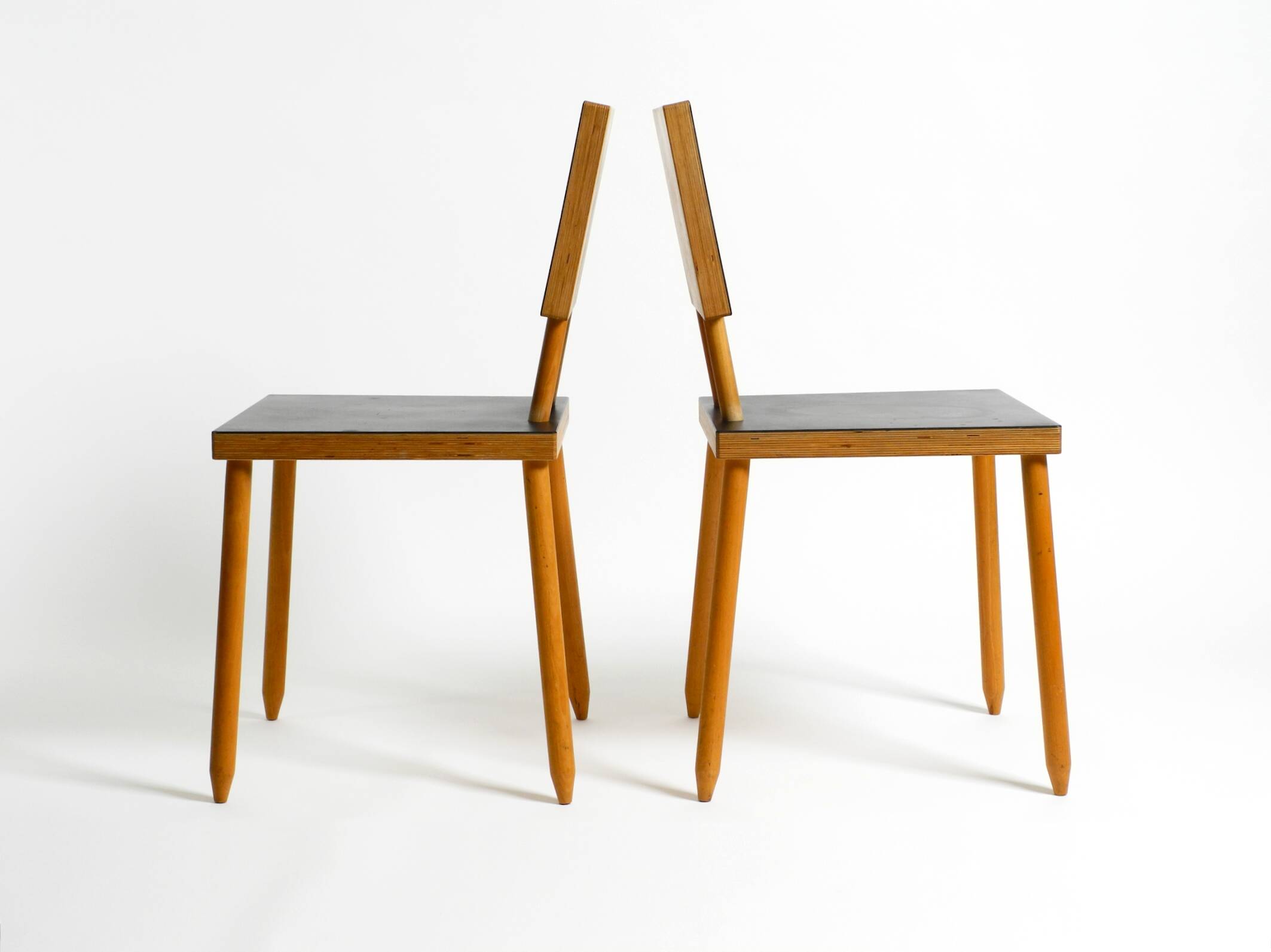 Two rare demountable plywood chairs by Axel Kufus model Stöcke for Atoll