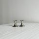 Pair of small light metal candlesticks
