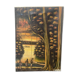Old african canvas under lively woods in tropical and lush forest signed to identify
