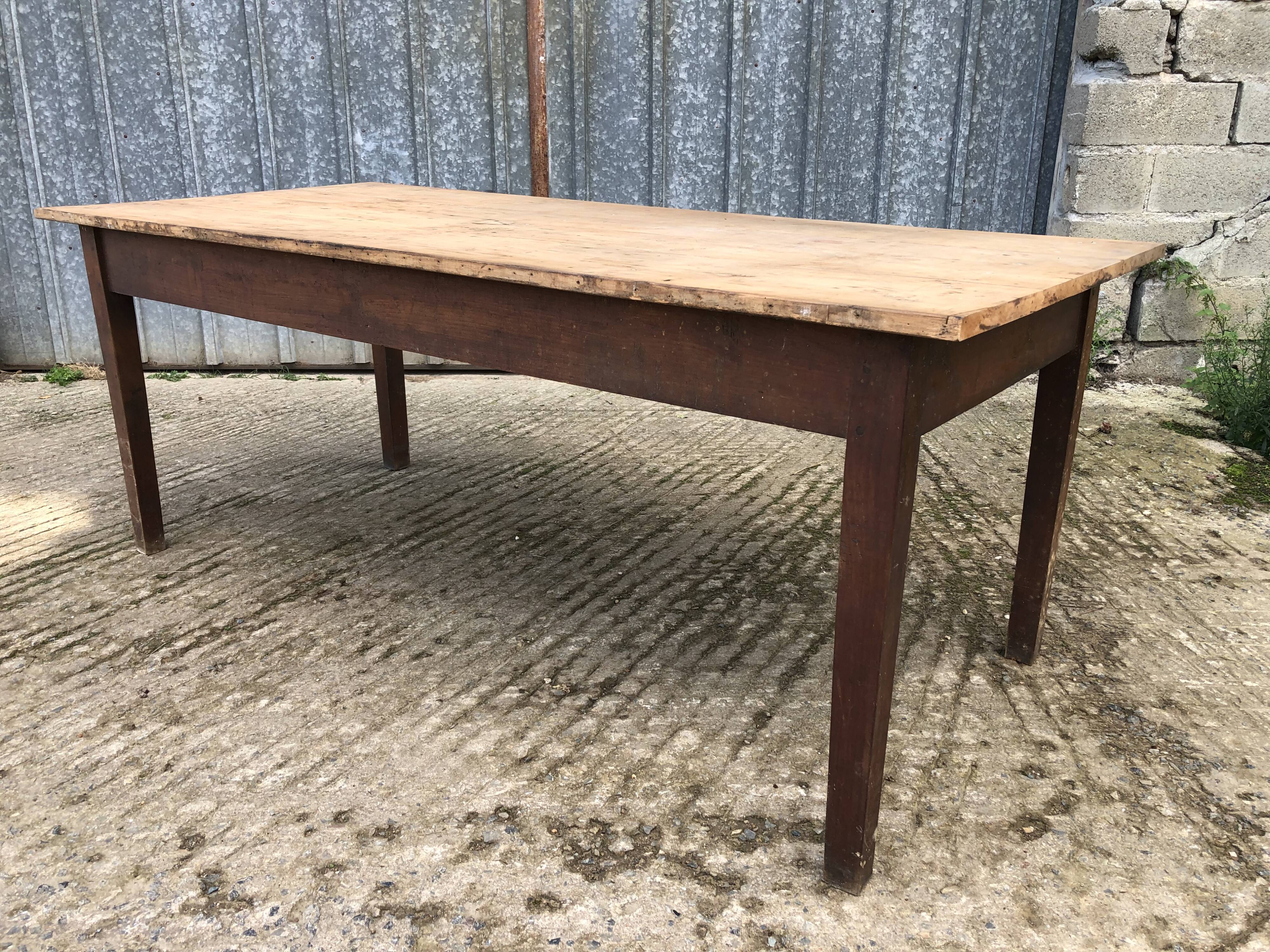 Rustic antique farmhouse table in solid cherry wood.