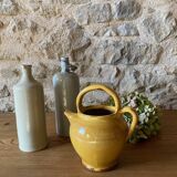 Jug or chevrette in yellow glazed stoneware