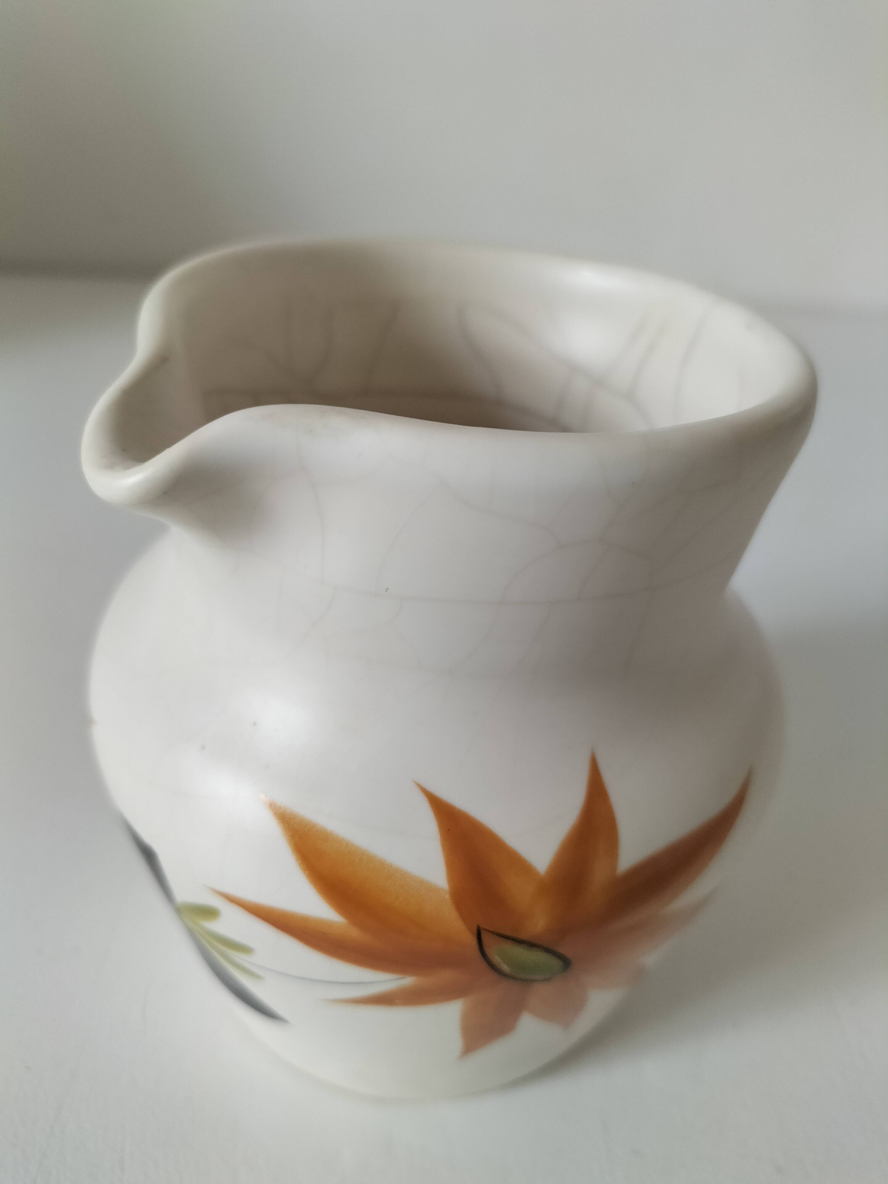Vintage Marais pottery pitcher with orange floral decoration