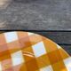 Set of nine flat ceramic plates yellow Scottish decoration in yellow/orange gridded ceramic