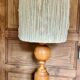 Turned wood base lamp with spun lampshade