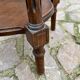 Old wooden pedestal table with marble top