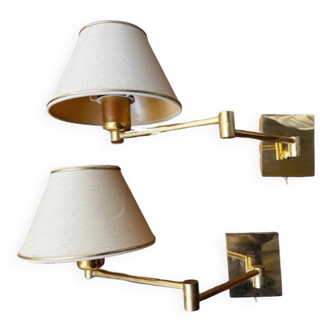 Pair of vintage brass wall lights with adjustable arms.