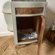 Pair of mismatched art deco bedside tables in green and wood