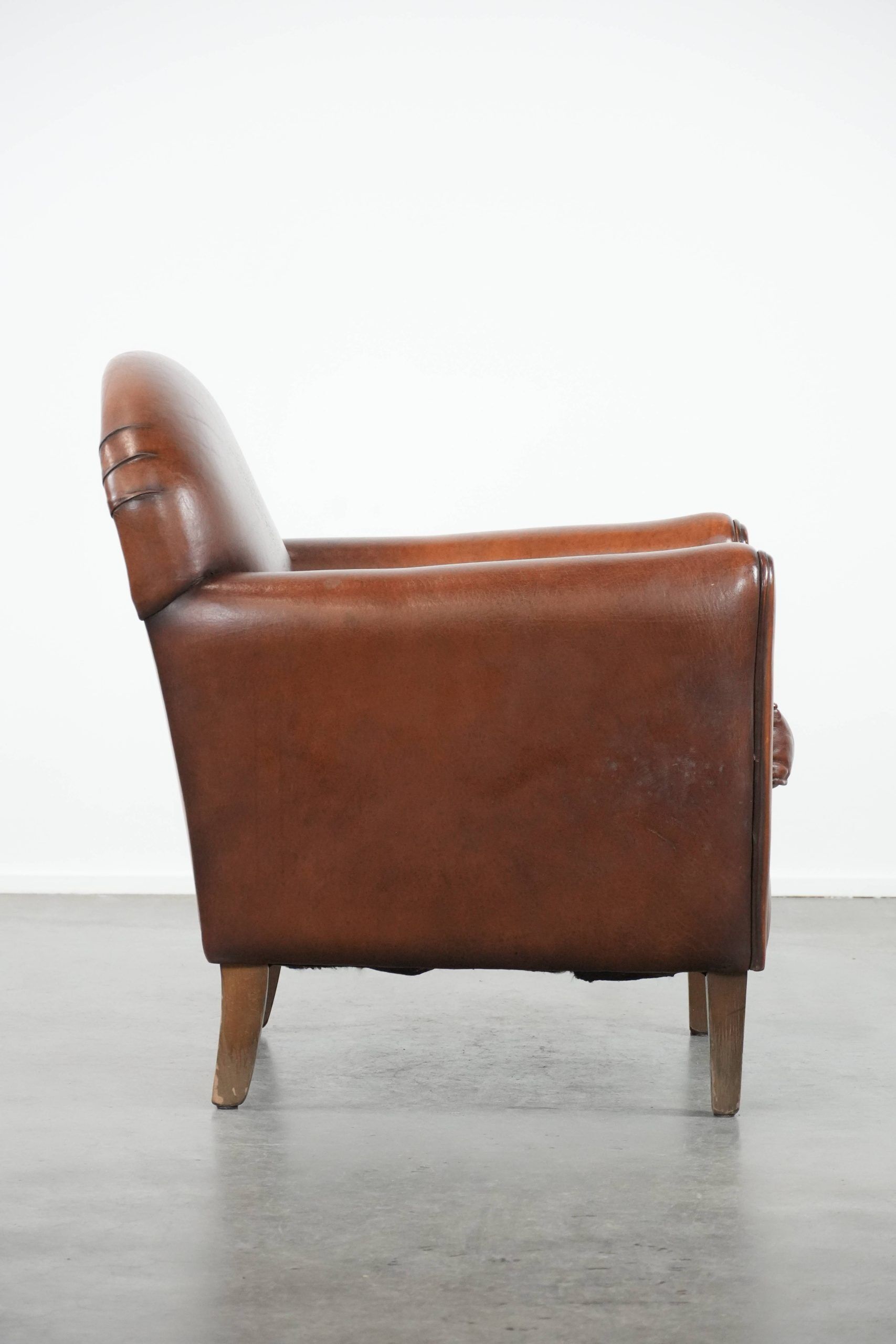 Armchair made of sheepskin leather in art deco design with warm colours