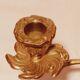 Old candle holder in gilded bronze