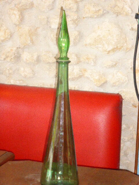 Vintage green faceted glass bottle with its cap 1970