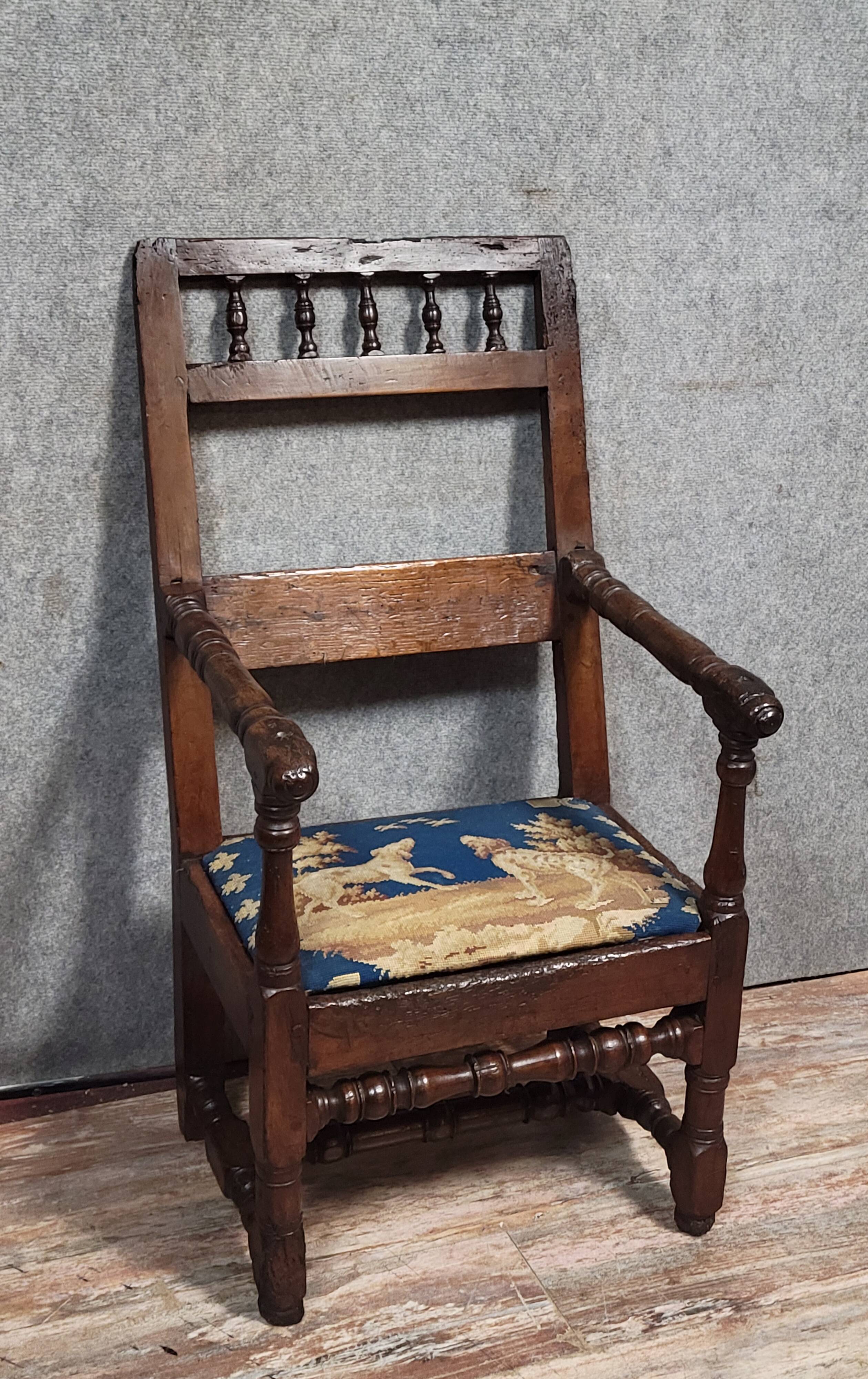 Louis XIII period armchair in solid wood