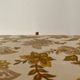Large vintage rattan and wicker sewing basket with floral decor seat