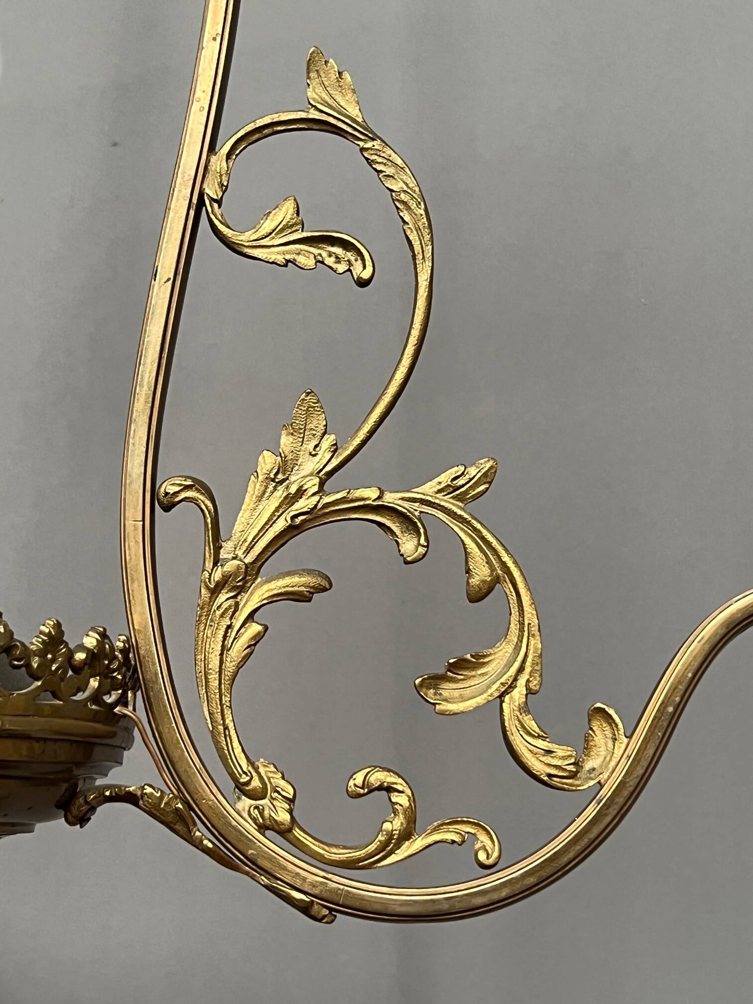 Renaissance chandelier with putti statuette.