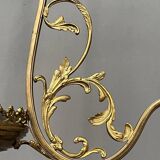 Renaissance chandelier with putti statuette.