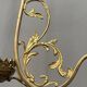 Renaissance chandelier with putti statuette.