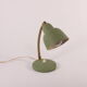 Flexible brass and green metal bedside lamp, 1950s.