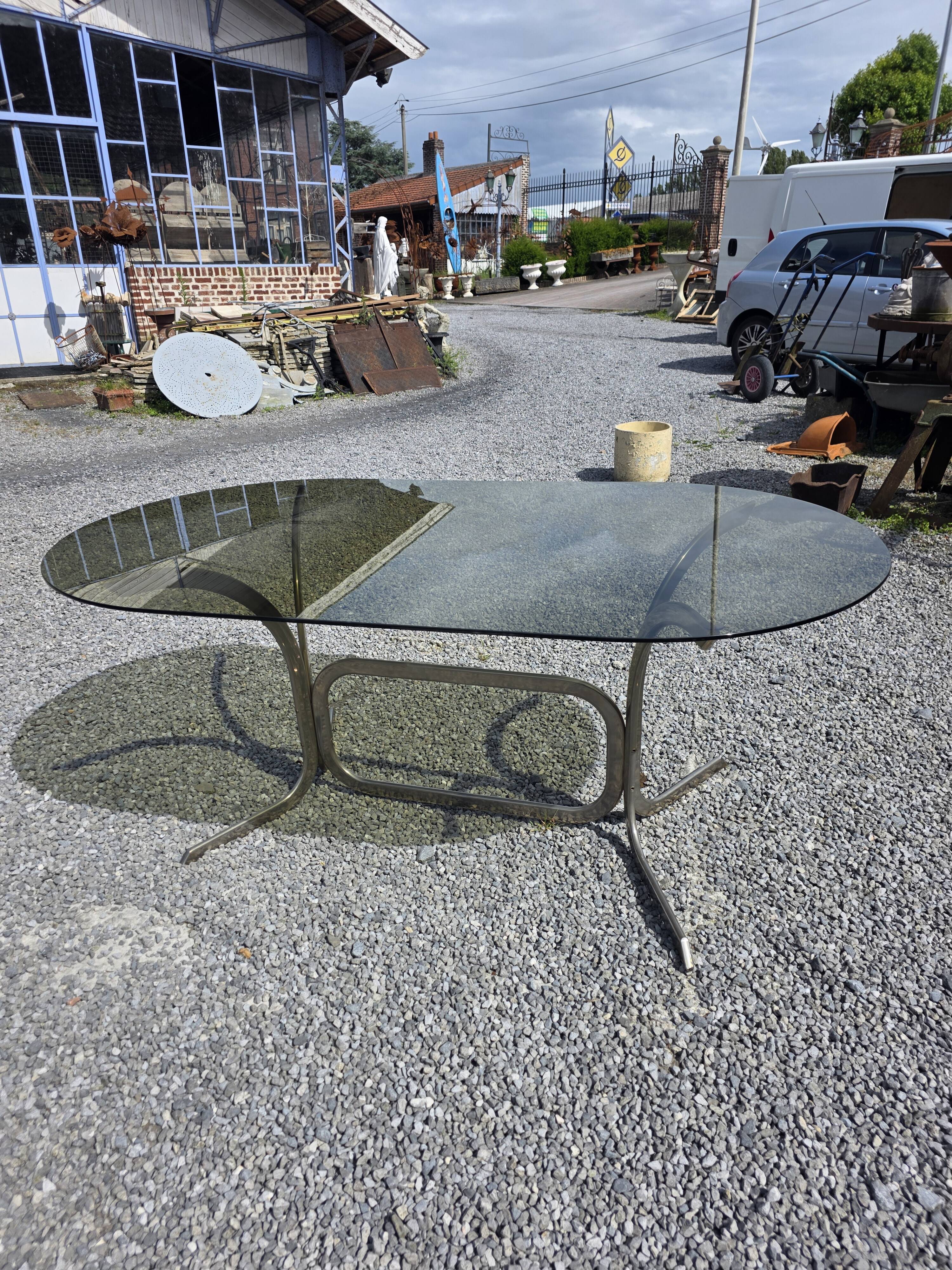 Silver metal table with smoked glass top from the 1970s.