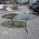 Silver metal table with smoked glass top from the 1970s.