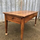Antique solid cherry farmhouse table with 2 end drawers and 1 pull-out.
