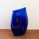 Blue blown glass vase and orange inclusion