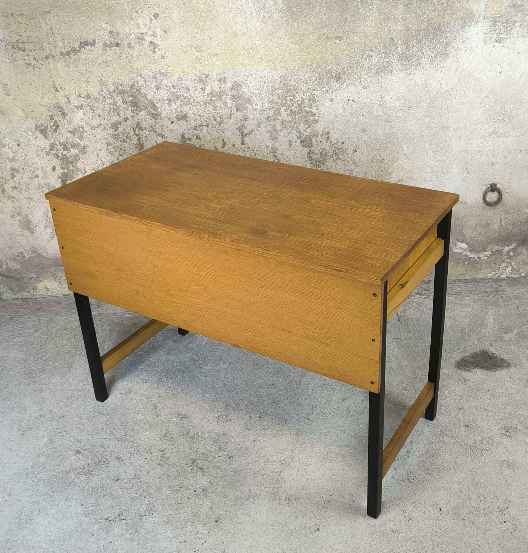 Vintage desk in modernist style made of wood.