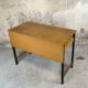 Vintage desk in modernist style made of wood.