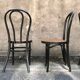 Two pairs of black 50s chairs - number 18 - cannée
