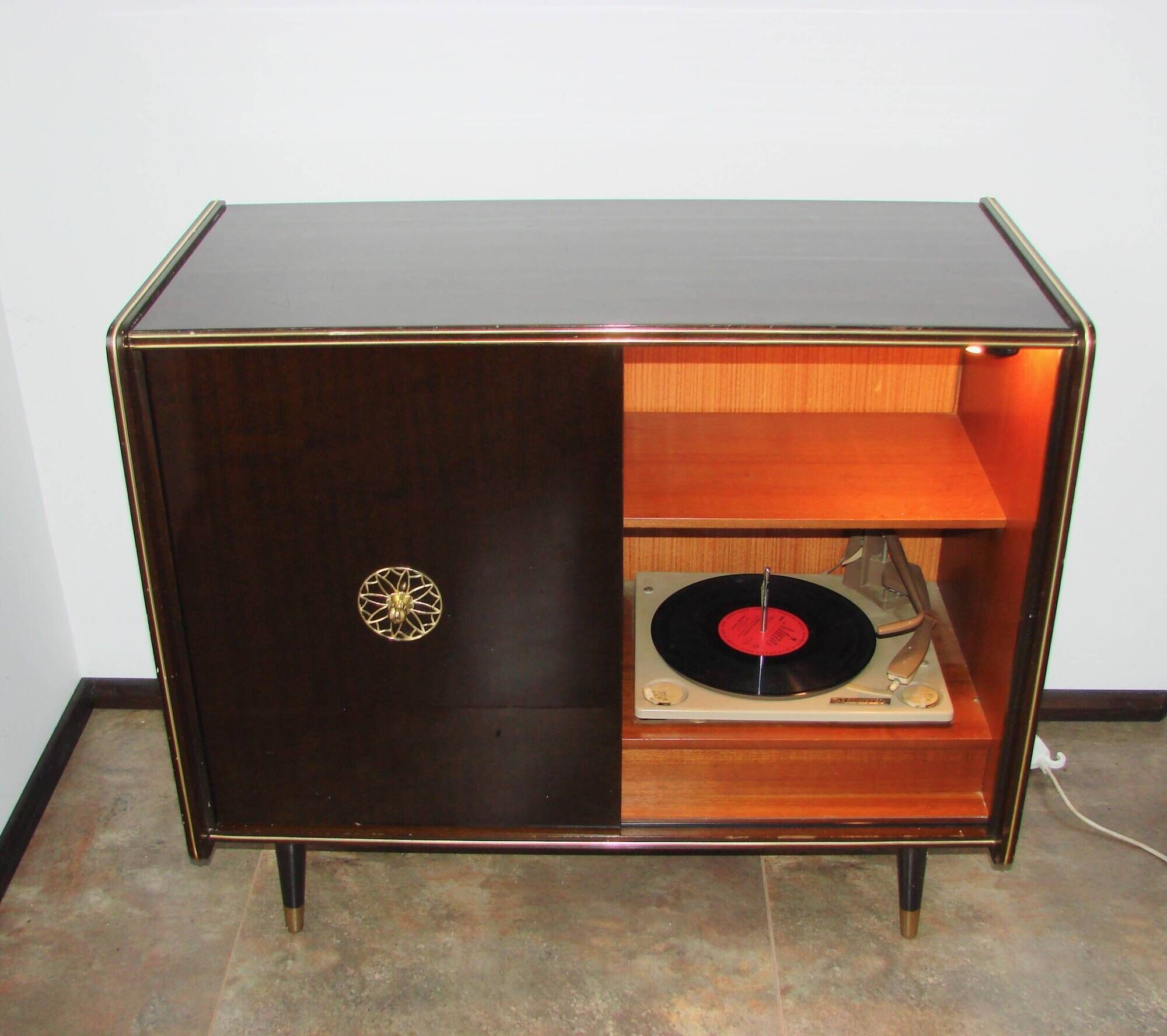 A vintage cabinet with a record player and a bar, 1960s.