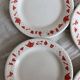 4 vintage porcelain dessert plates with red border and breakfast motif