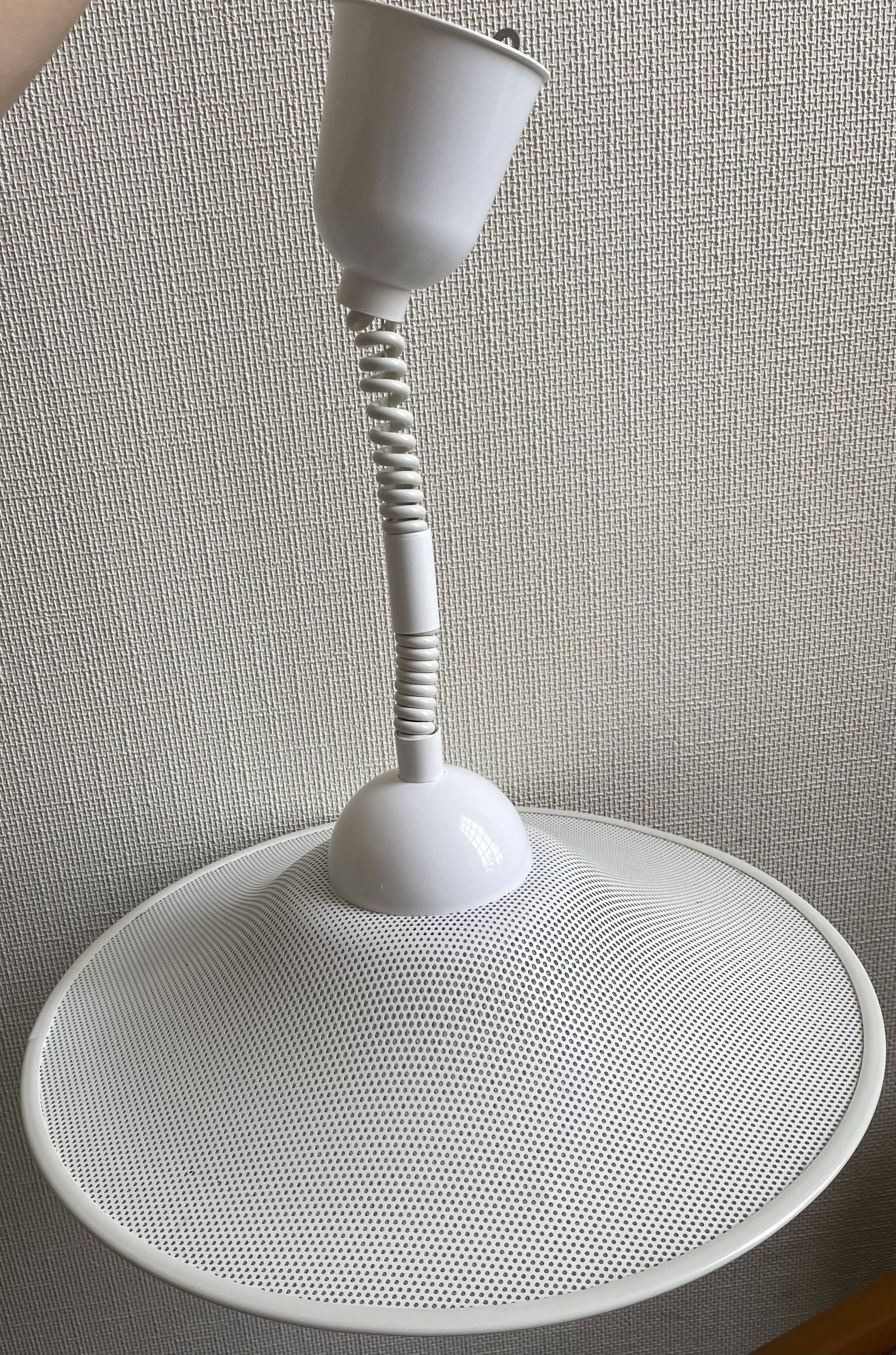 Suspension of the 80s in perforated white metal