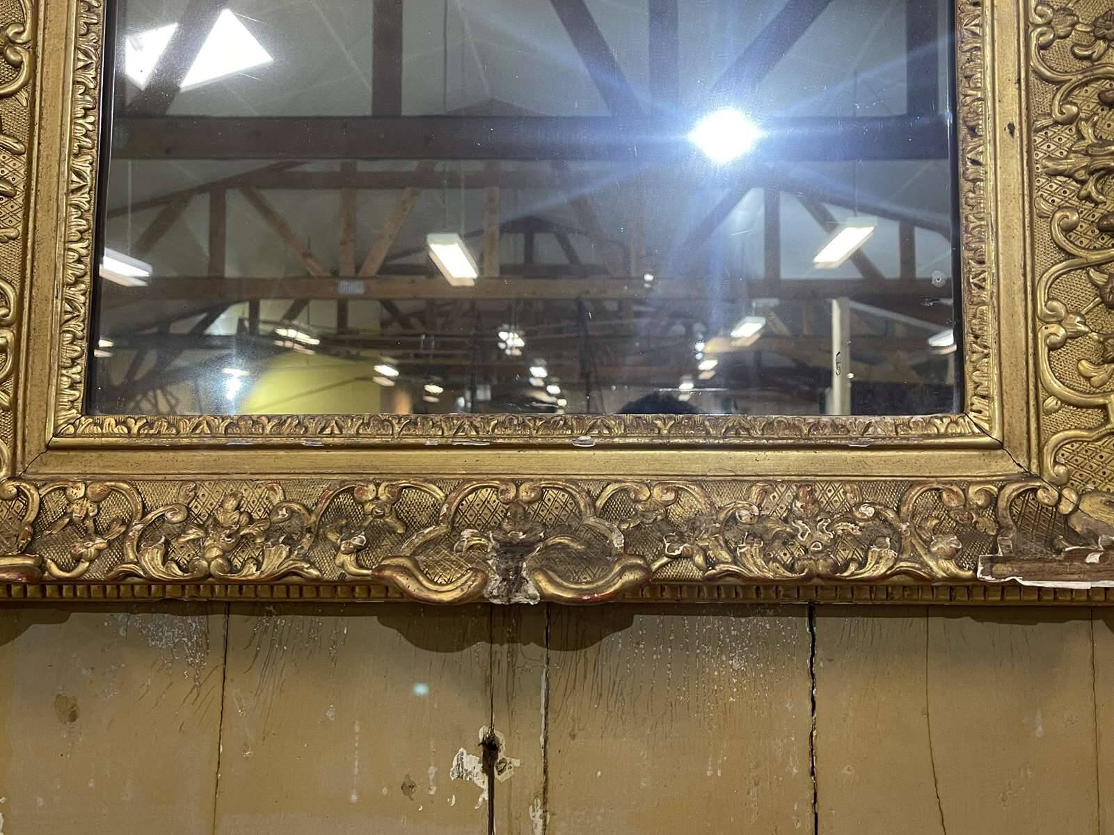 18th century Regency mirror in gilded wood