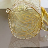 Pitcher in crumpled glass