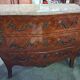 Curved Louis XV style commode with marquetry, opening with three drawers.