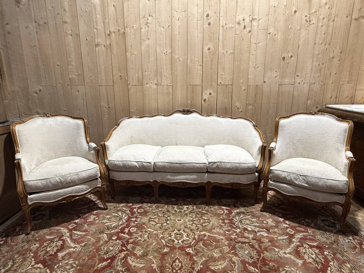 Beige Louis XV style salon sofa and pair of armchairs.