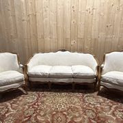 Beige Louis XV style salon sofa and pair of armchairs.
