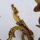 Antique pair of double-light bronze wall sconces with acanthus leaves. 1950s