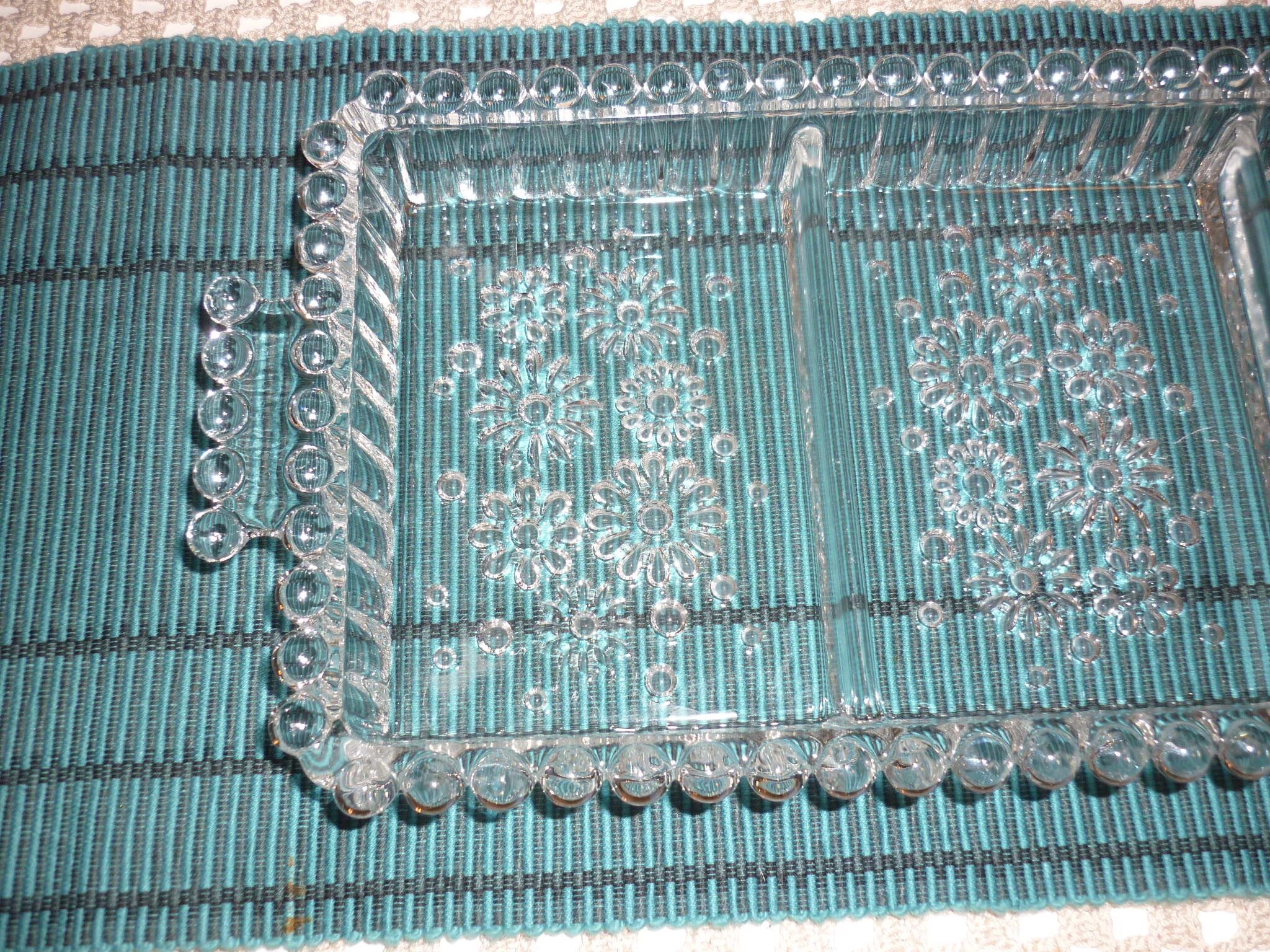 Antique dish in chiseled glass with pearls