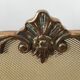 Copper-colored metal fireplace firewall