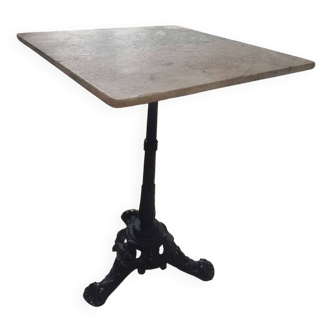 Bistro table with cast iron and white marble legs