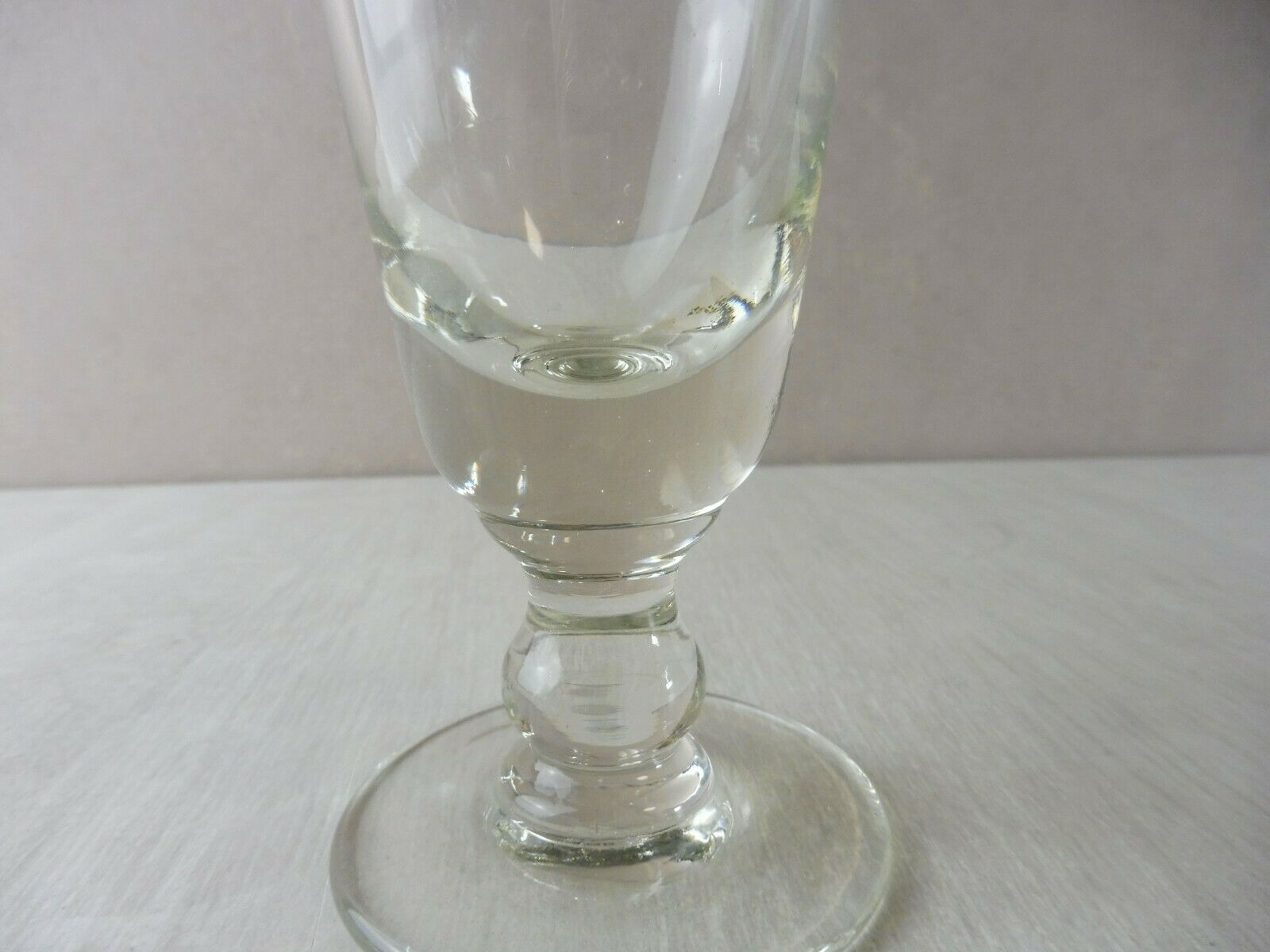 Old wormwood glass in molded glass, in thick glass