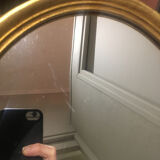Golden oval mirror 26x32cm
