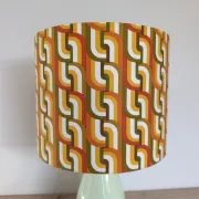 Seventies spirit lamp with geometric orange/green lampshade.