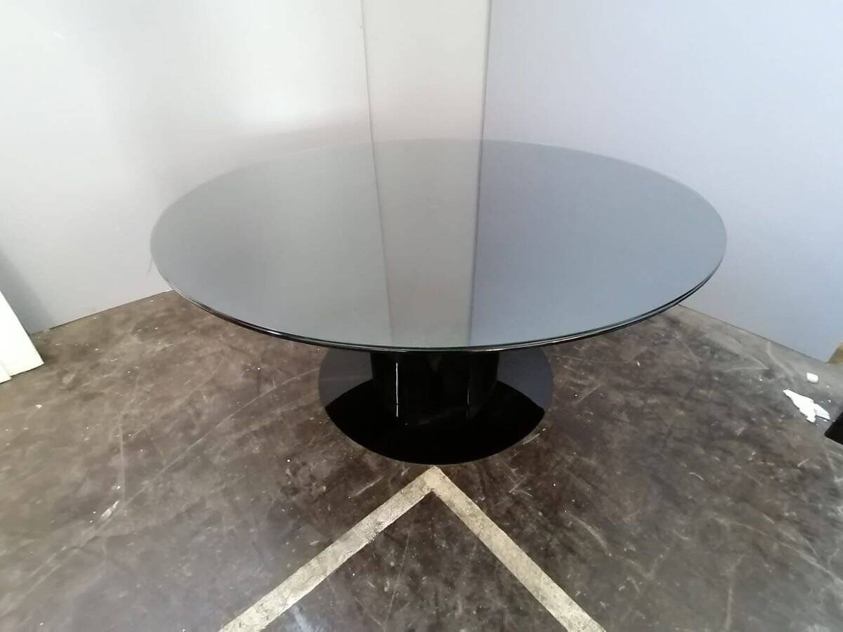 Black lacquered glass table and glass in the hoof style, Italy.