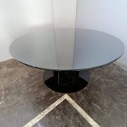 Black lacquered glass table and glass in the hoof style, Italy.