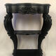 Pair of blackened wooden consoles, marble top