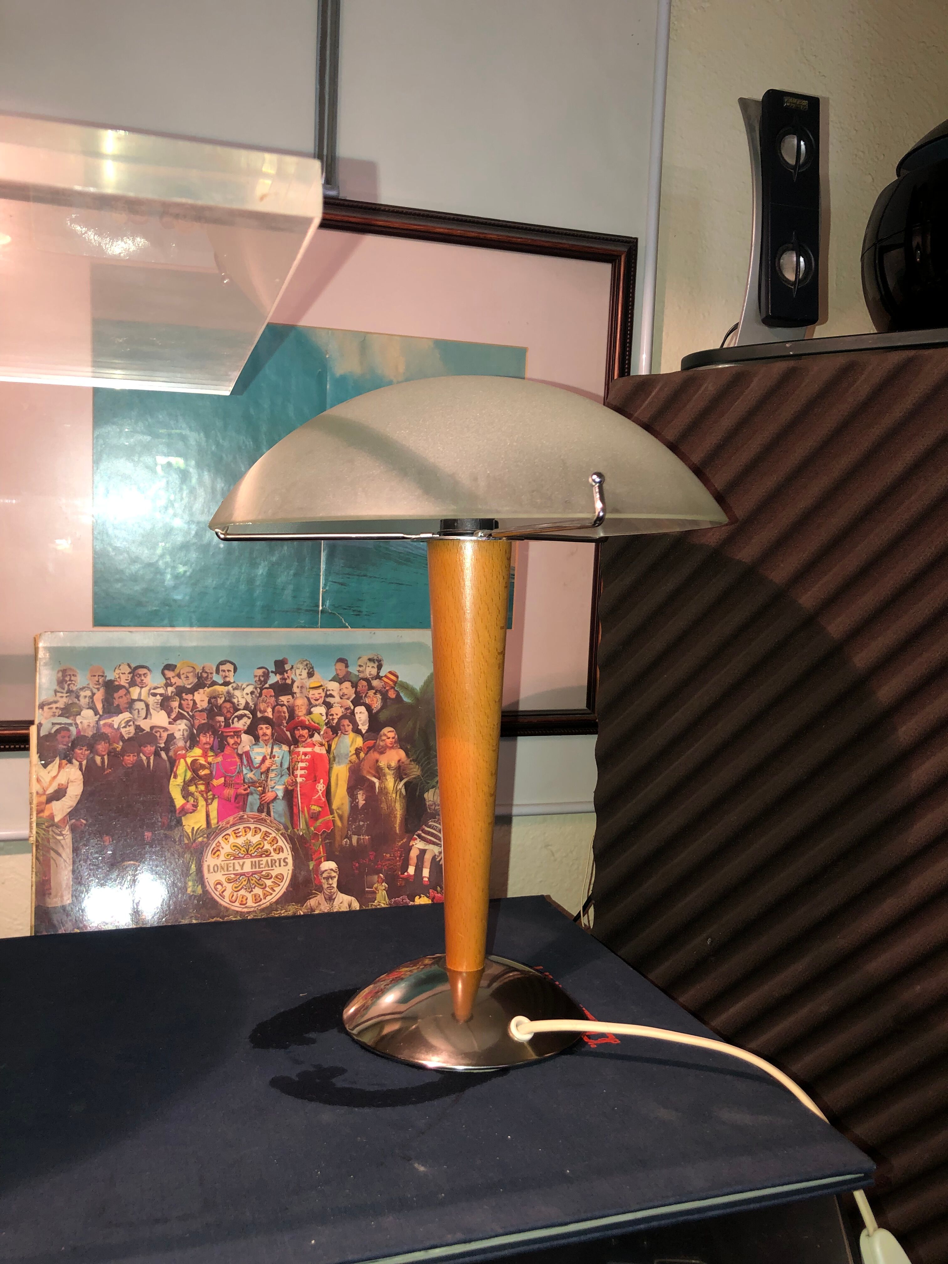 Table lamp legs chrome wood lampshade opaque glass.