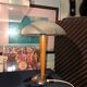 Table lamp legs chrome wood lampshade opaque glass.