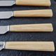 Philos - Set of 12 stainless steel dessert knives with bakelite handles.